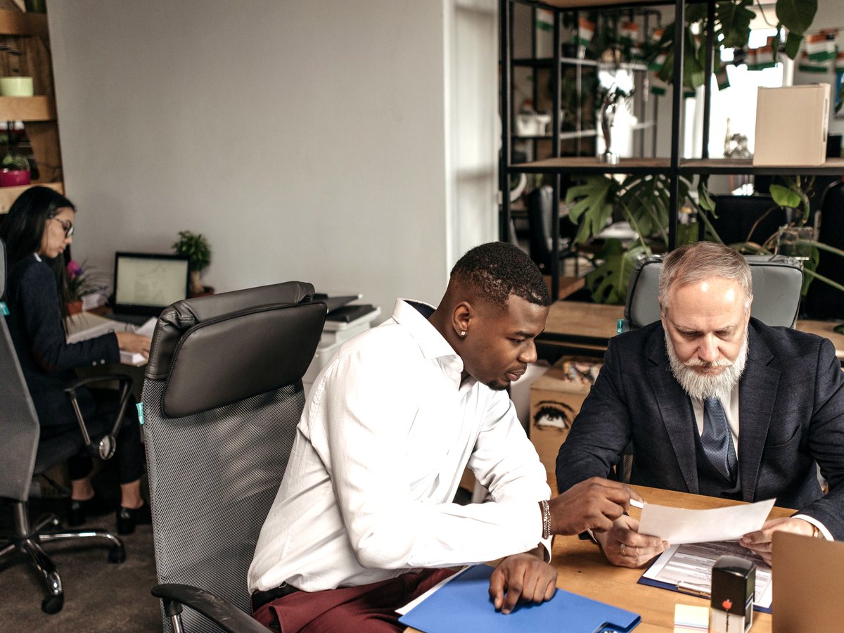 A service team reviewing project documents in an office